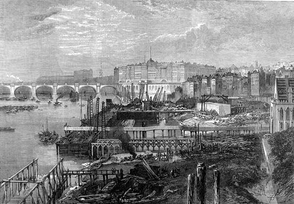 The construction of the Victoria Embankment in London, England. This section in the foreground is near the Inner Temple and the Middle Temple. Somerset House is in the background. The bridge is the old version of Waterloo Bridge (Illustrated London News, 1865)